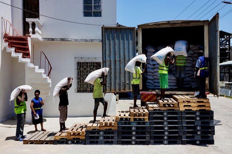 Workers at Kenya's Mombasa port move bags of yellow split peas from warehouses to trucks heading to WFP's operations in the region. Photo: WFP/Luke Dray