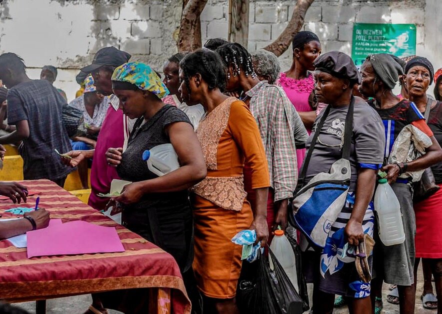 People line up for WFP food assistance in Port--au-Prince, Haiti, one of the countries at risk of famine. Photo: WFP/Luc Junior Segur
