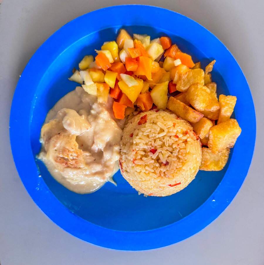 A school meal on blue plate