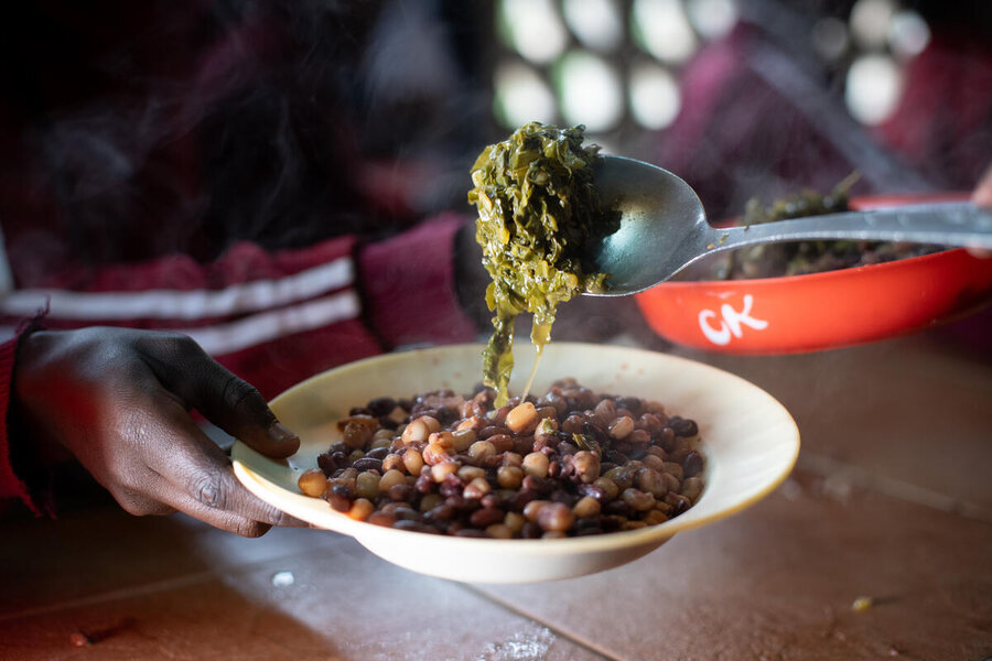 A hearty plate of beans and greens being served up at a Kenyan school. Photo: WFP/Lisa Murray