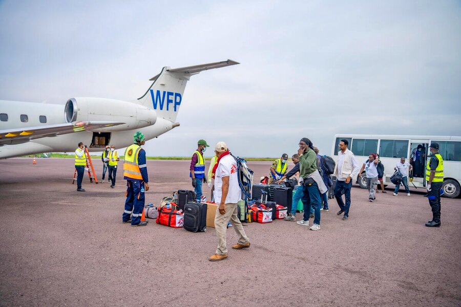 Aid workers board a WFP-operated UNHAS plane. Photo: WFP/Michael Castofas