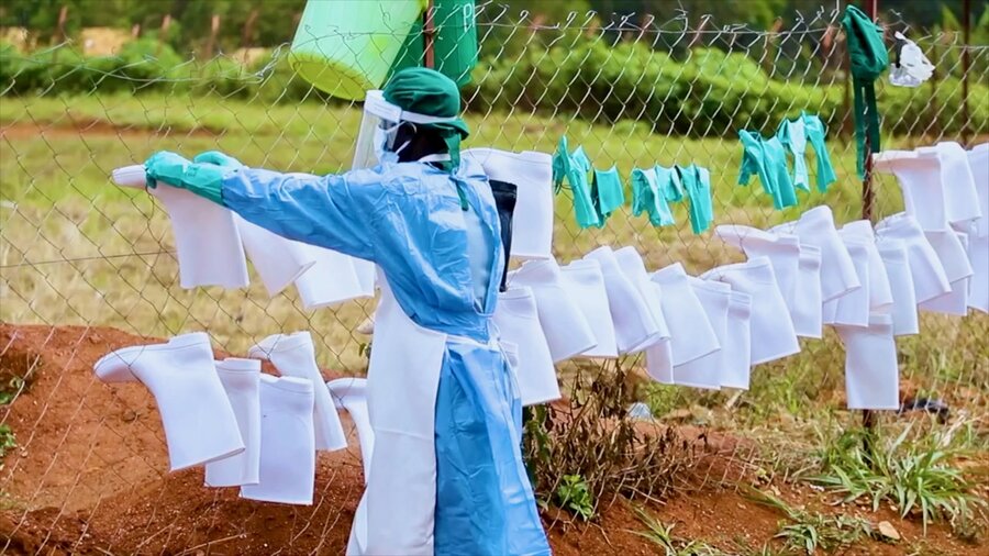 A health worker hangs up cleaned personal protective equipment in northeastern Democratic Republic of the Congo. Photo: WFP/Arete Seros Muisa