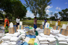 Photo: WFP/ Claire Nevill, At WFP food distributions in Zimbabwe community members stand at least one metre apart and collect their food in groups of five, to prevent overcrowding.