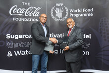 Photo: WFP/Photogallery. Moataz Abdel Rahman, General Manager of The Coca Cola Company in Egypt and Praveen Agrawal, WFP Representative and Country Director in Egypt sign agreement to launch joint programme.