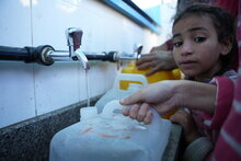 A girl lines up for food at a school in Gaza. Credit: WFP/Arete Abood Al Sayd