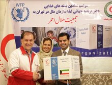 From left to right: Falah al-Hajarf, acting Minister of the Kuwaiti Embassy to Iran, Negar Gerami, WFP Country Director in Iran, and Morteza Salimi, President of The Iranian Relief and Rescue Organization. Photo: WFP/Neda Mobarra