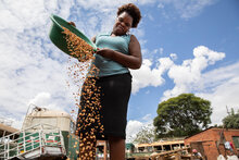 “In Zimbabwe, Edith Ndebele (37) winnowing her roasted and ground peanuts at her small processing operation in Bulawayo, Zimbabwe. She makes her living by making peanut butter and is a participant in WFP’s Urban Resilience project. © WFP/Samantha Reinders.”