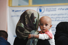 Photo: WFP/Mohammad Hasib Hazinyar. A mother with her daughter come to the Bagrami clinic which is under WFP support on malnutrition activities. she has brought her malnourished daughter to the clinic to get WFP's support and malnutrition supplementary. Kabul, Afghanistan.