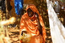 Photo: WFP/Mohamed Galal. A family that doesn't have money or anything and they don't have what to eat, they eat the residuals from the production of groundnut oil called Ombaz. Sudan, North Darfur, Zamzam Camp.  