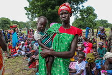 Photo: WFP/Eulalia Berlanga. Woman and child waiting to be registered in SCOPE