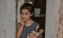 little girl eating bread 