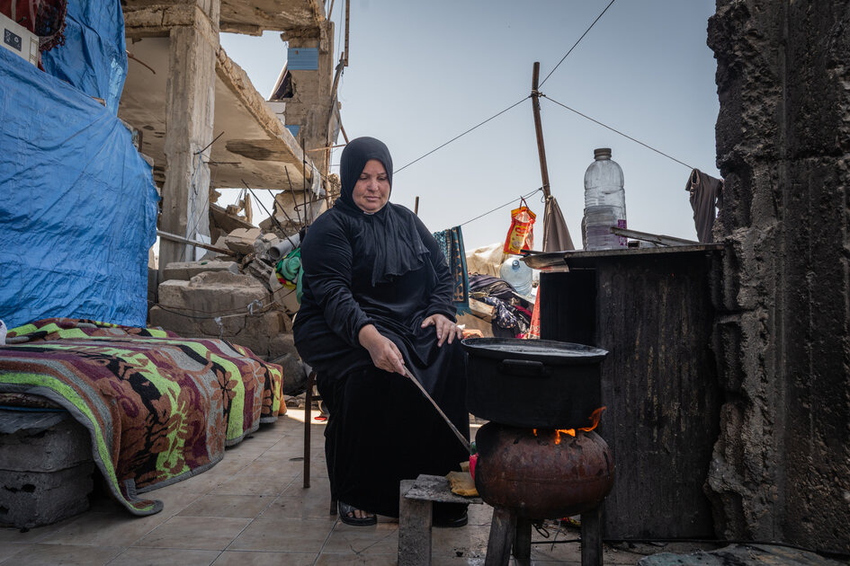 A family living in a damaged building in Gaza.
