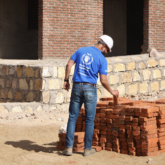 WFP staffer working on a construction project