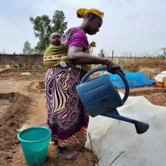 Mother of a household, beneficiary of the 4R Project, as part of risk reduction activities - through WFP's Food Assistance for Assets (FAA), climate services and market development. 