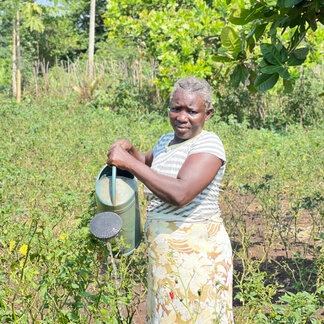 A farmer from the Camavo community who has benefited from training on gender and new techniques for producing and processing maize. Photo:WFP/Jorcilina Correia