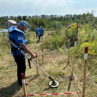 WFP staff searching mines in the agricultural land