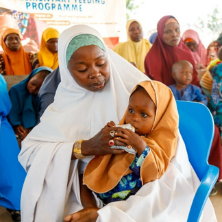 Bawagana (25) accesses treatment for her baby's Moderate Acute Malnutrition (MAM) at a WFP supported nutrition clinic at the IDP Camp in Northeast Nigeria.