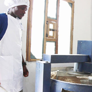 A man in a gown is working