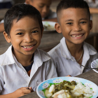 Children from Kok Kreul Primary school in Siem Reap province are having breakfast at their school. They always receive the hot meal everyday supported by School Feeding programme of World Food Programme and funded by other donors.