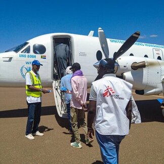 Passengers board a UN Humanitarian Air Service aircraft, providing vital access to remote and hard-to-reach communities.