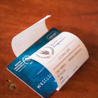 Beneficiary's SCOPE card at the WFP food distribution to Congolese refugees in Nyankanda camp in eastern Burundi.