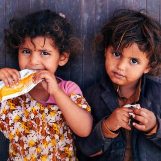 Schoolchildren with fortified food rations distributed by WFP. Photo: WFP/Malehloa Letsie