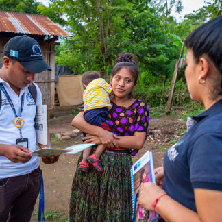 Edin Maquin and Evelyn Garcia (Health and Nutrition Brigades) provide nutrition counseling to Marcela at her house in Alta Verapaz, Guatemala.