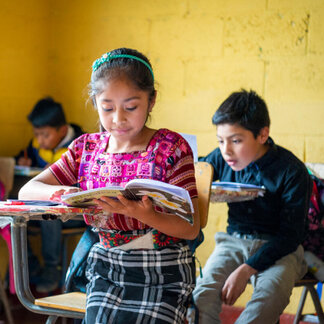 Madelyn (10) attends class at "Escuela Oficial Rural Mixta Cojobal", in the municipality of Patzún, Chimaltenango, Guatemala on 10 August 2023.