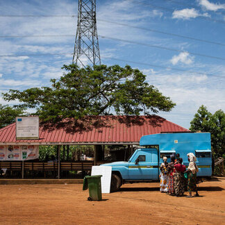 A truck is waiting in front of a house