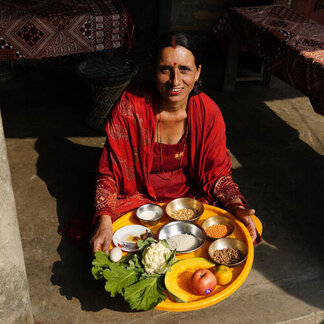 a woman is showing the meals she prepared