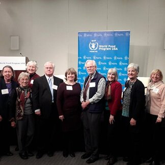 A group of people posing after a meeting