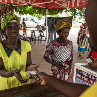 Beneficiaries receiving cash under first cycle of cash transfers as part of the anticipatory action activation, Caia district, Sofala province