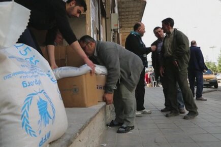 Displaced Families Receiving Food Inside War-Torn Syria
