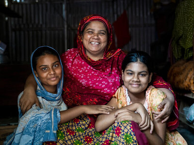 Photo: WFP/Sayed Asif Mahmud A woman who is a participant of the Urban Food Programme with her two daughters